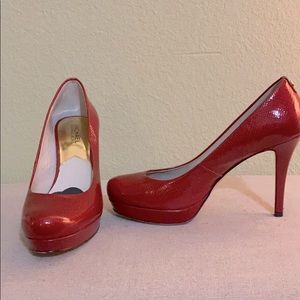 Shiny red pumps